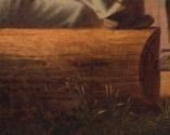 Detail of a realistically painted log end; tufts of grass sprout along base
