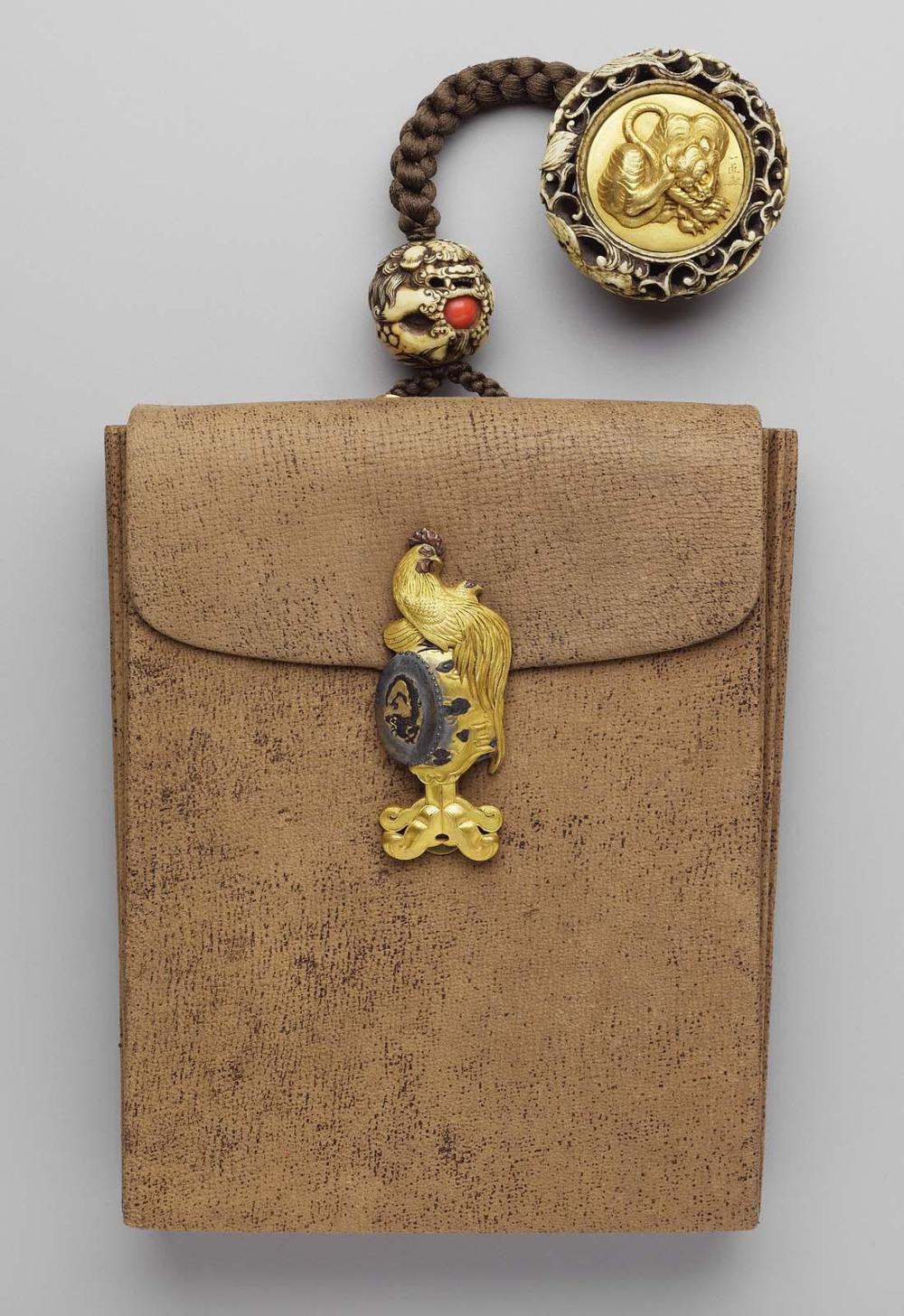 Tobaccopouch; kagami netsuke with design of a tiger; kanamono in the